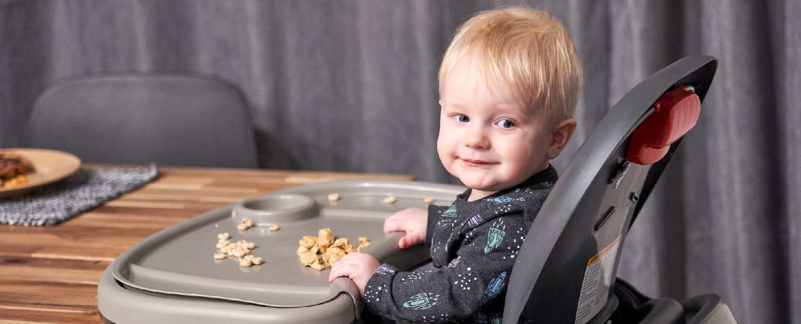 Booster seat that attaches to outlet table