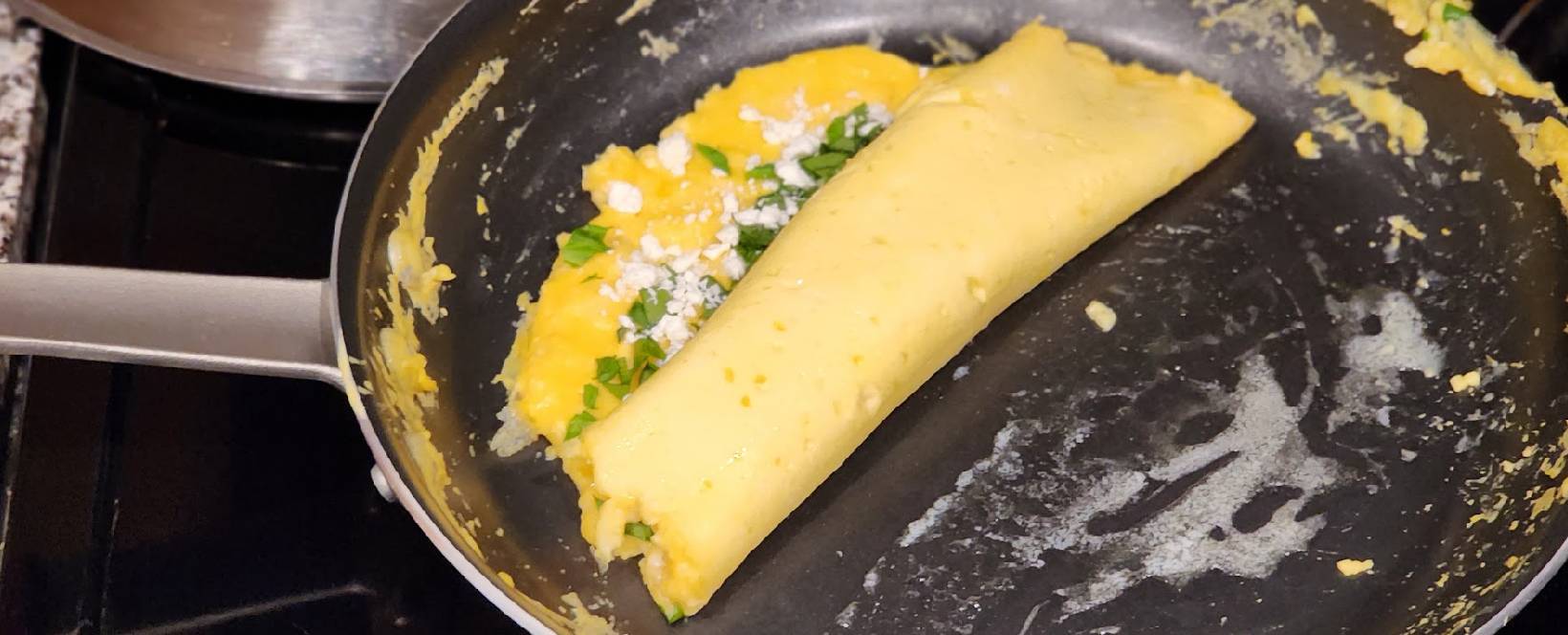 https://themamasaur.com/wp-content/uploads/2023/11/half-folded-French-omelette.jpg